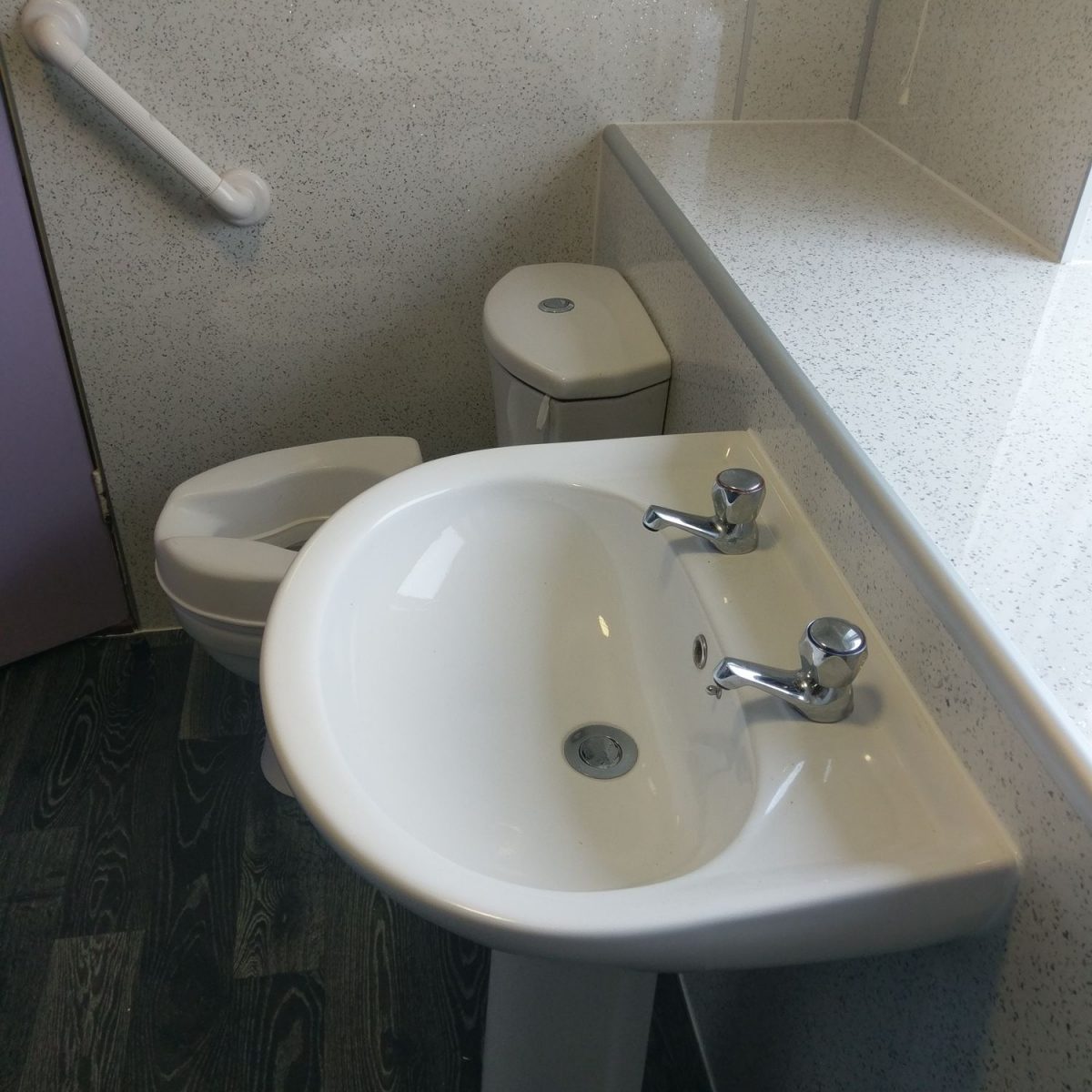 Wet wall bathroom fitting
